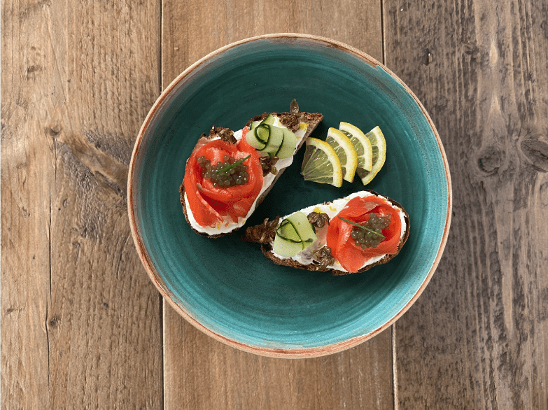open sandwich with salmon and algae pearls